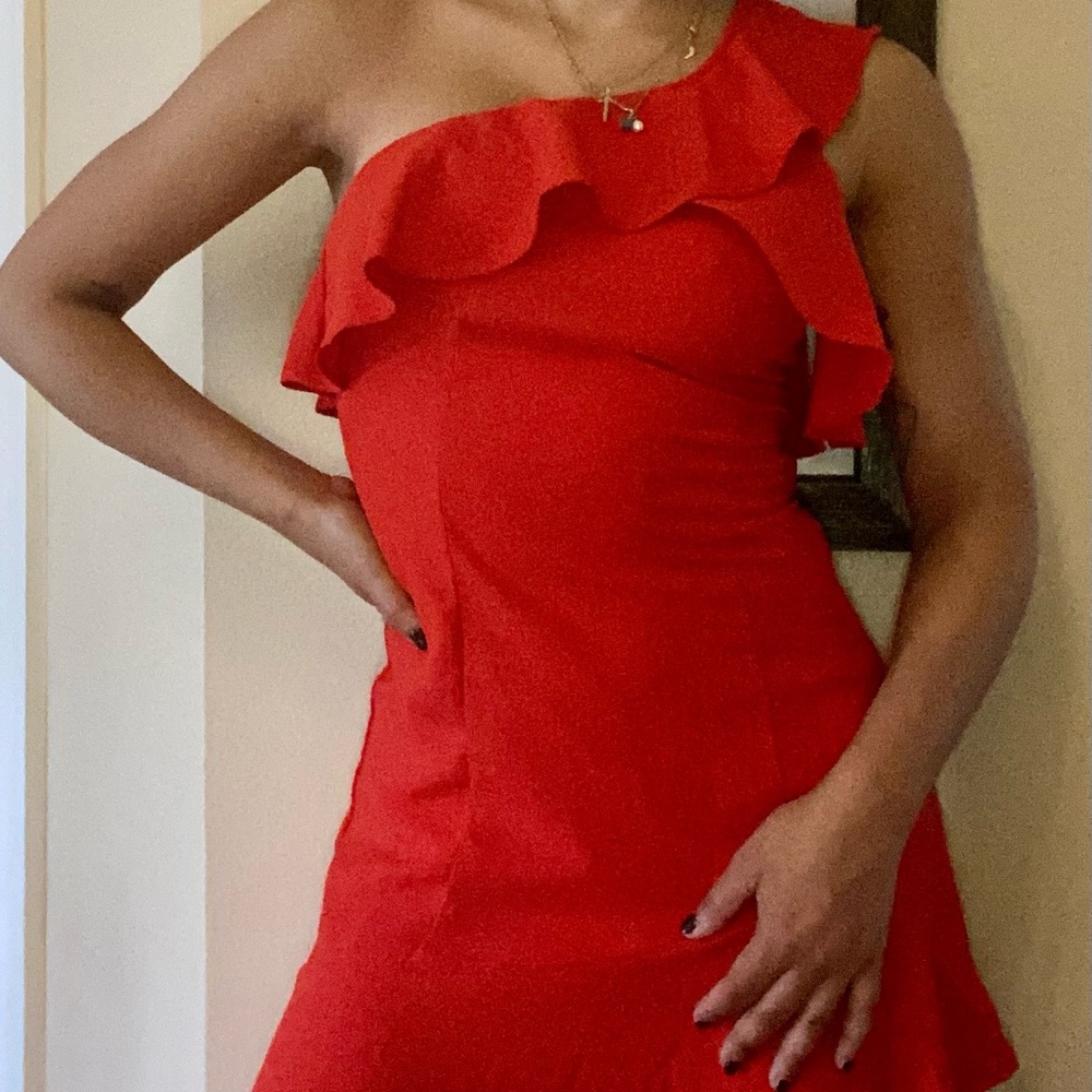 One-shoulder coral dress with ruffles